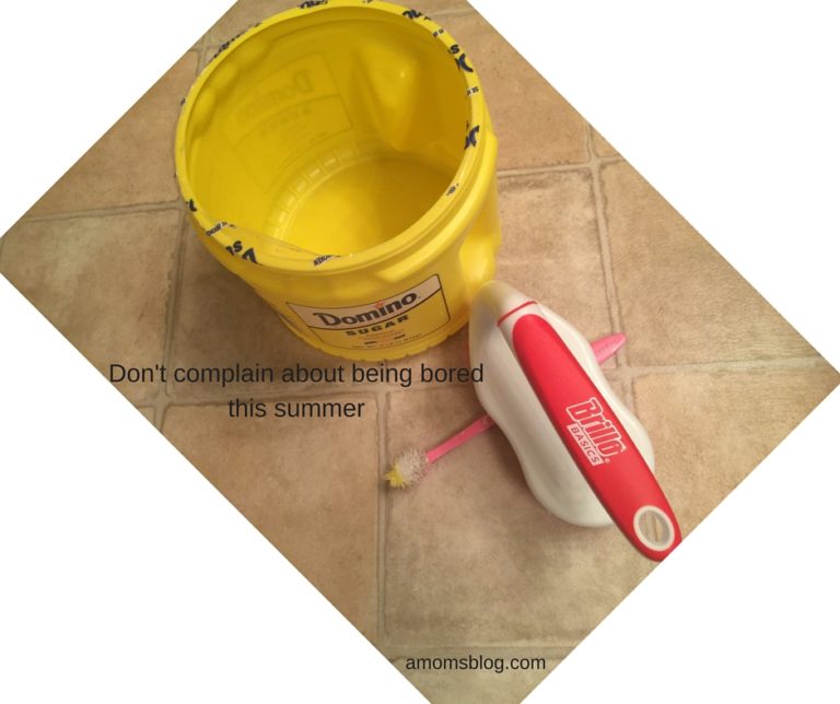 A yellow bucket and a red handle on the floor