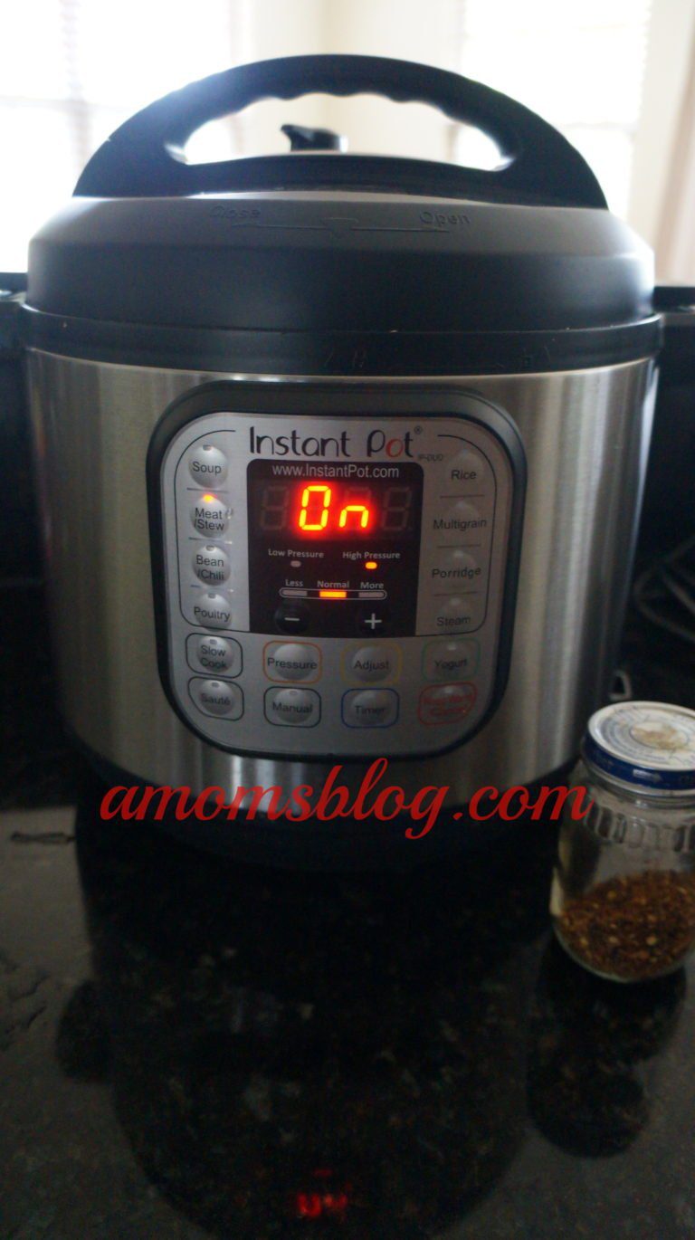 A close up of an instant pot with the timer on