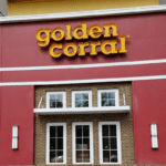 A red building with the words " golden corral ".