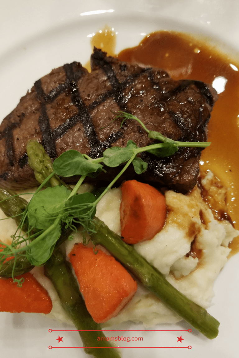 A plate of food with meat and vegetables.