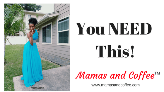 A woman in blue dress standing outside of a house.