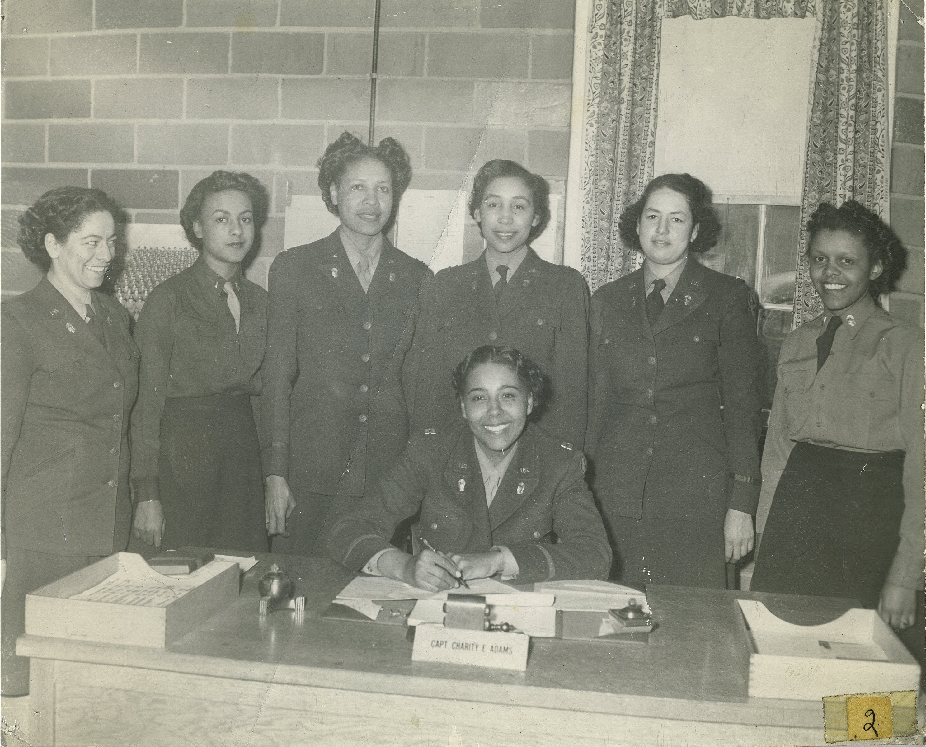 A group of women in uniform posing for the camera.