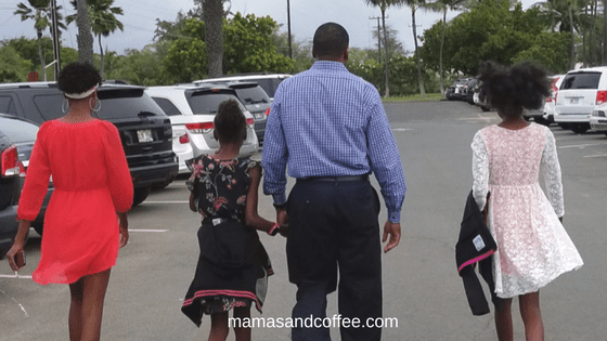 Black father walking with his daughters- I see black people