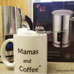 A coffee pot and mug on the counter.