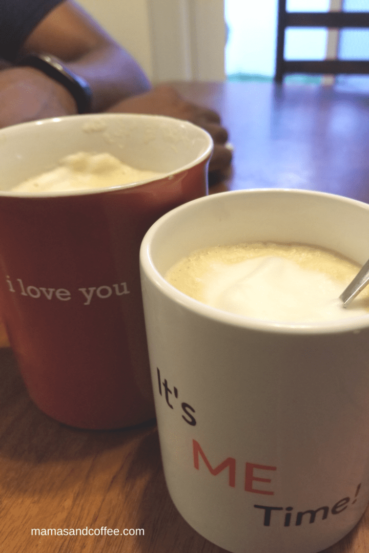 A coffee pot and mug on the counter.