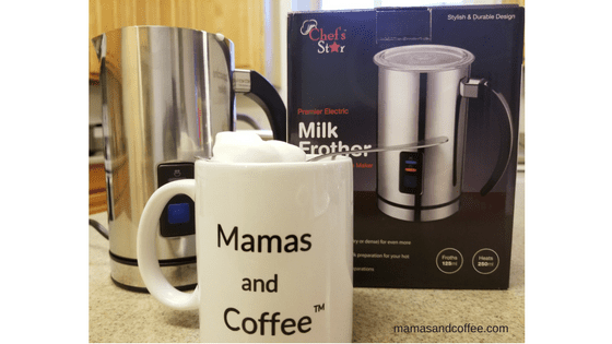 A coffee pot and mug on the counter.