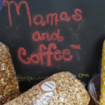 A chalkboard sign with some food on it