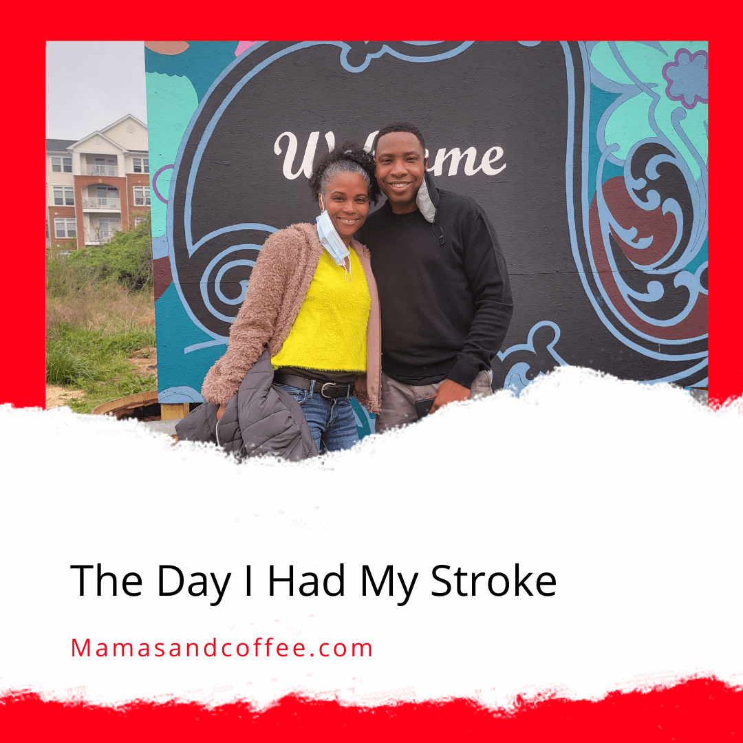 A man and woman standing in front of a sign.